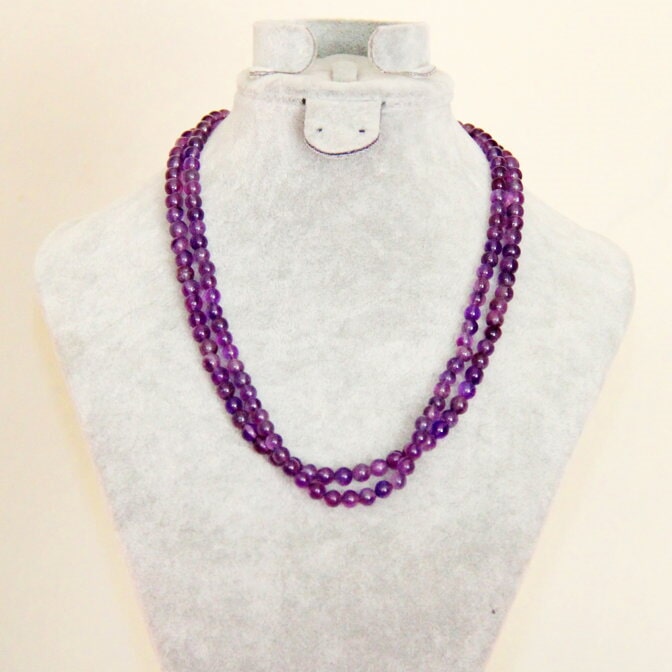Three strands of purple beads