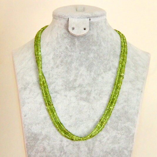 Three strands of light green beads