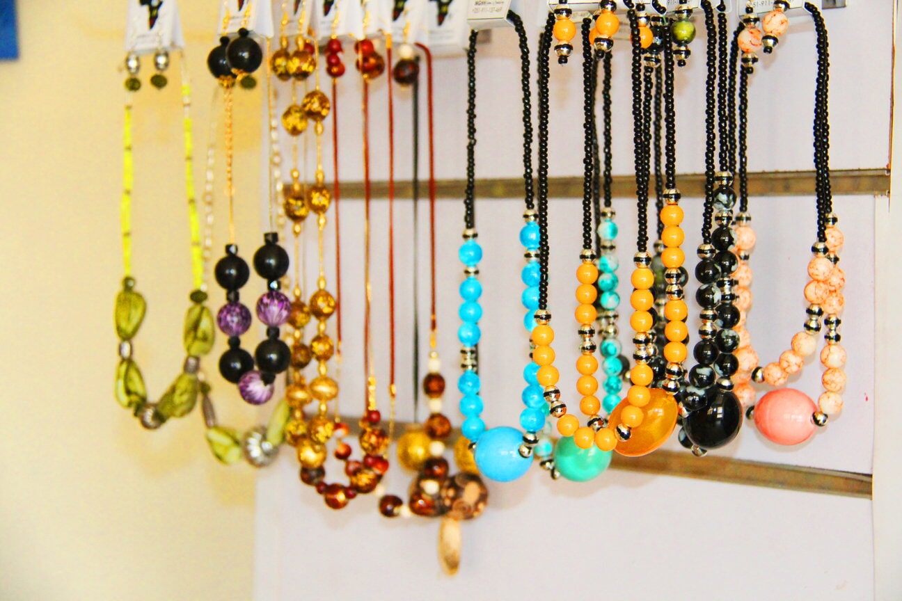 Colourful necklaces hanging on a shop display